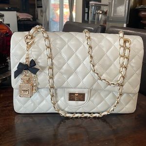 White quilted shoulder/Crossbody bag with cute charms.